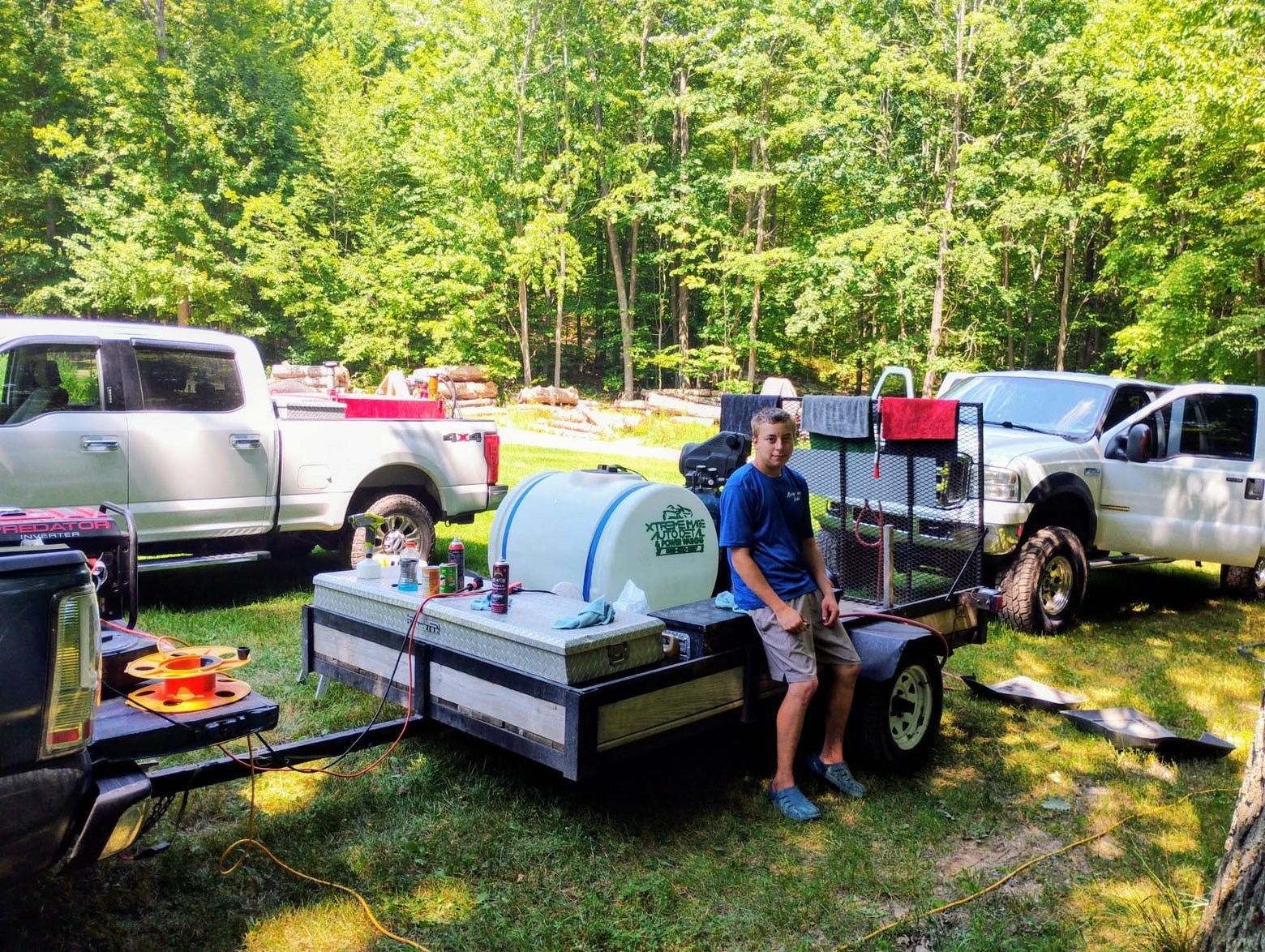 Professional auto detailer carefully polishing a luxury vehicle