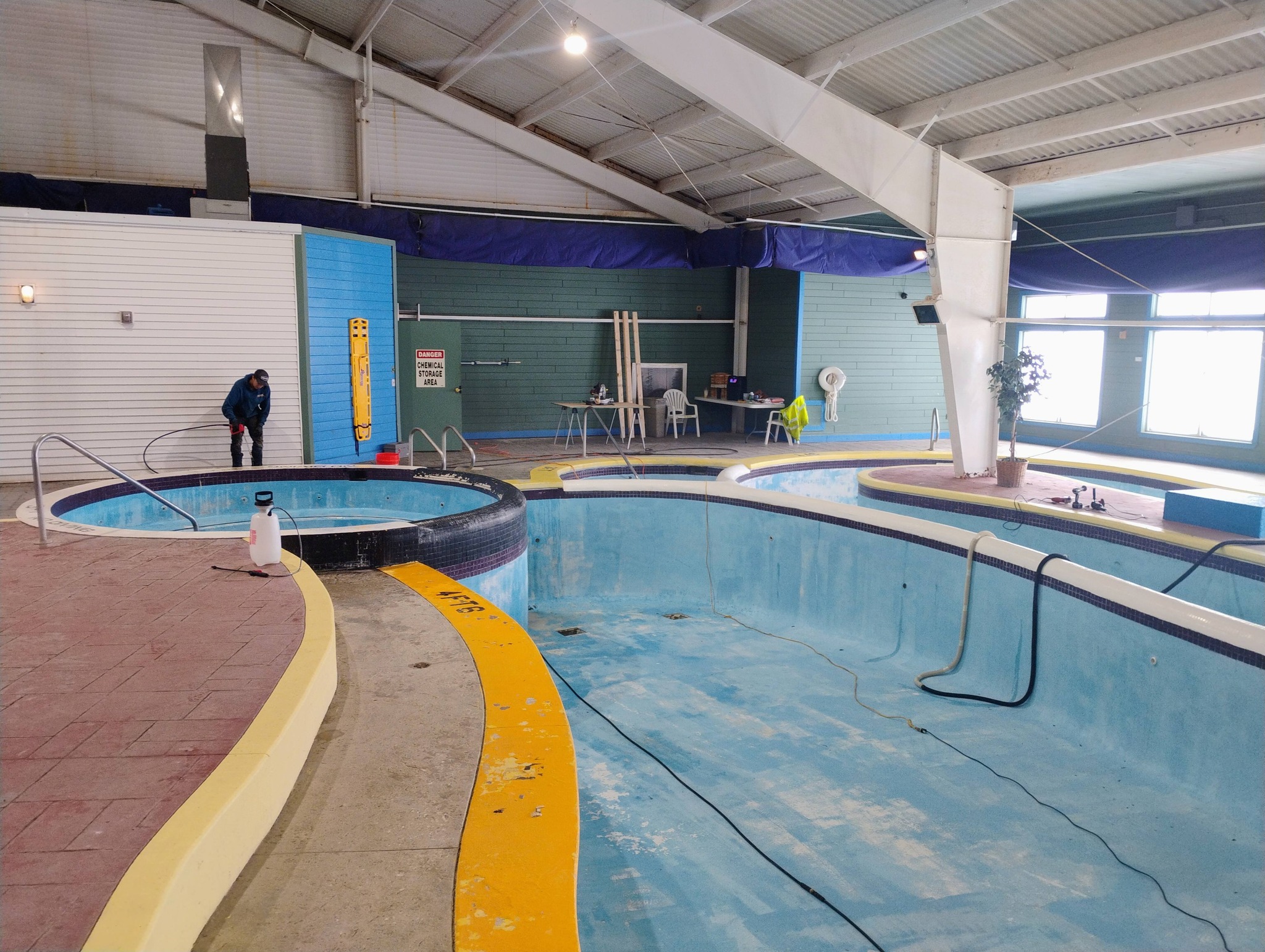 Wooden deck being pressure washed