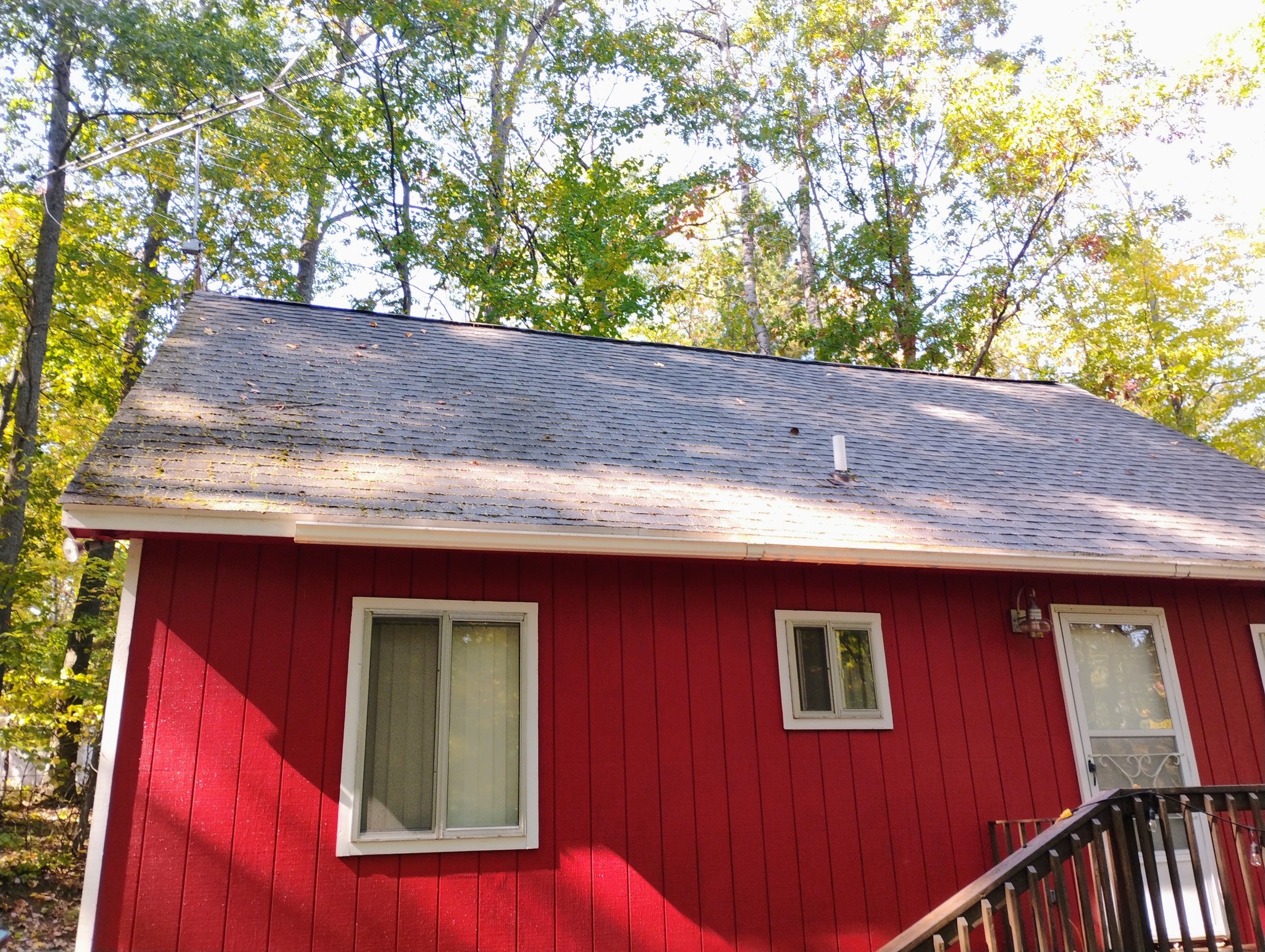 Brick house exterior being power washed